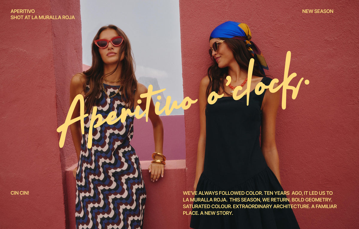 Two women posing in front of a textured pink wall, styled with sunglasses and fashion accessories, overlaid with Italian text 'Aperitivo o'clock' and 'Cin Cin!'.
